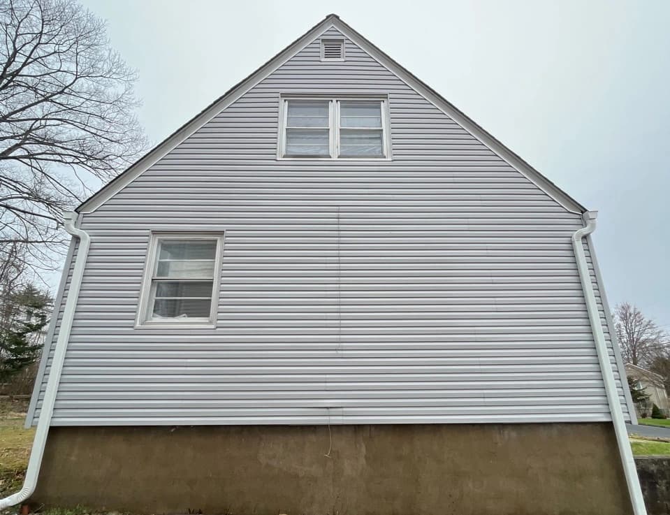 Kent Power Washing technician performing detailed house washing in Kent residential area